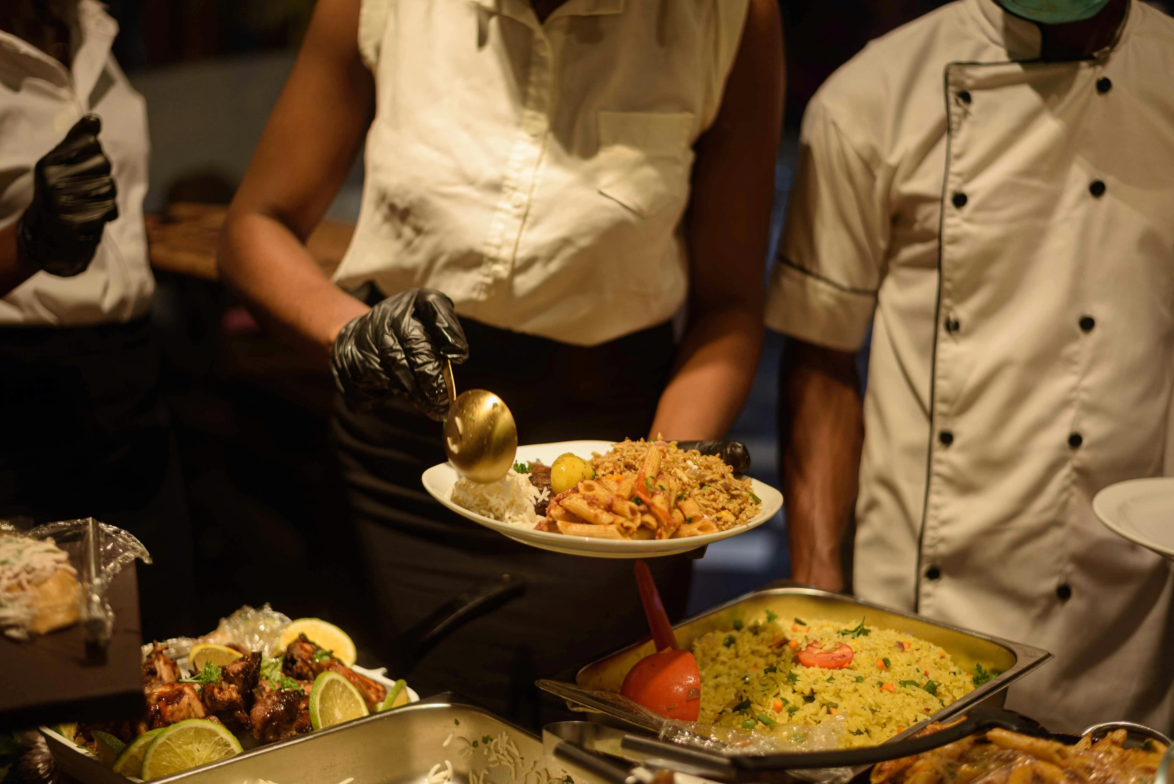 Catering staff plating food for a private Punta Cana event