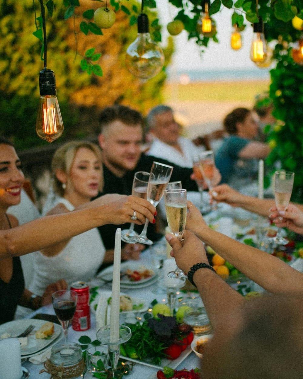 Group champagne celebration at a private outdoor event in Punta Cana