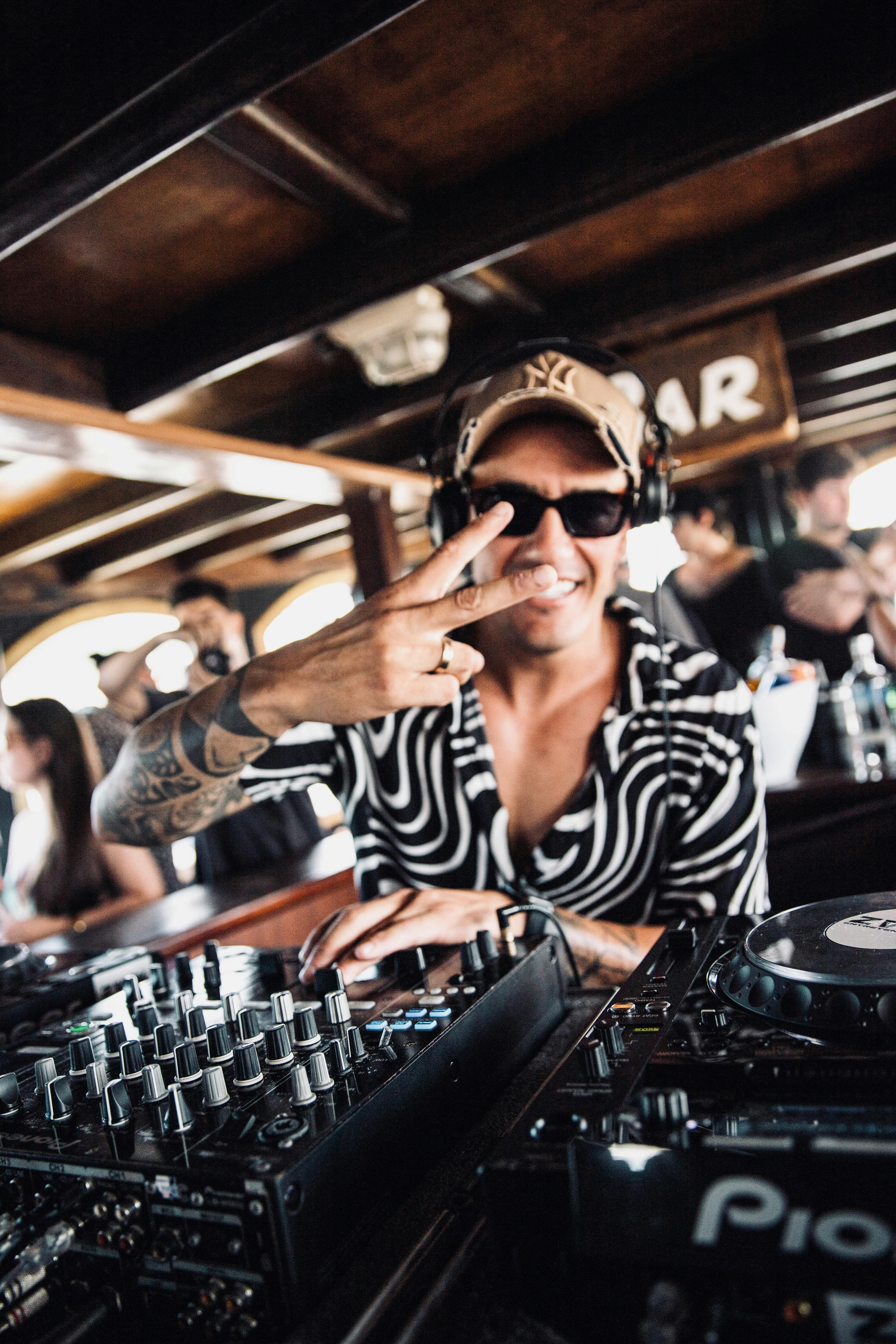 DJ playing at a lively VIP nightlife venue