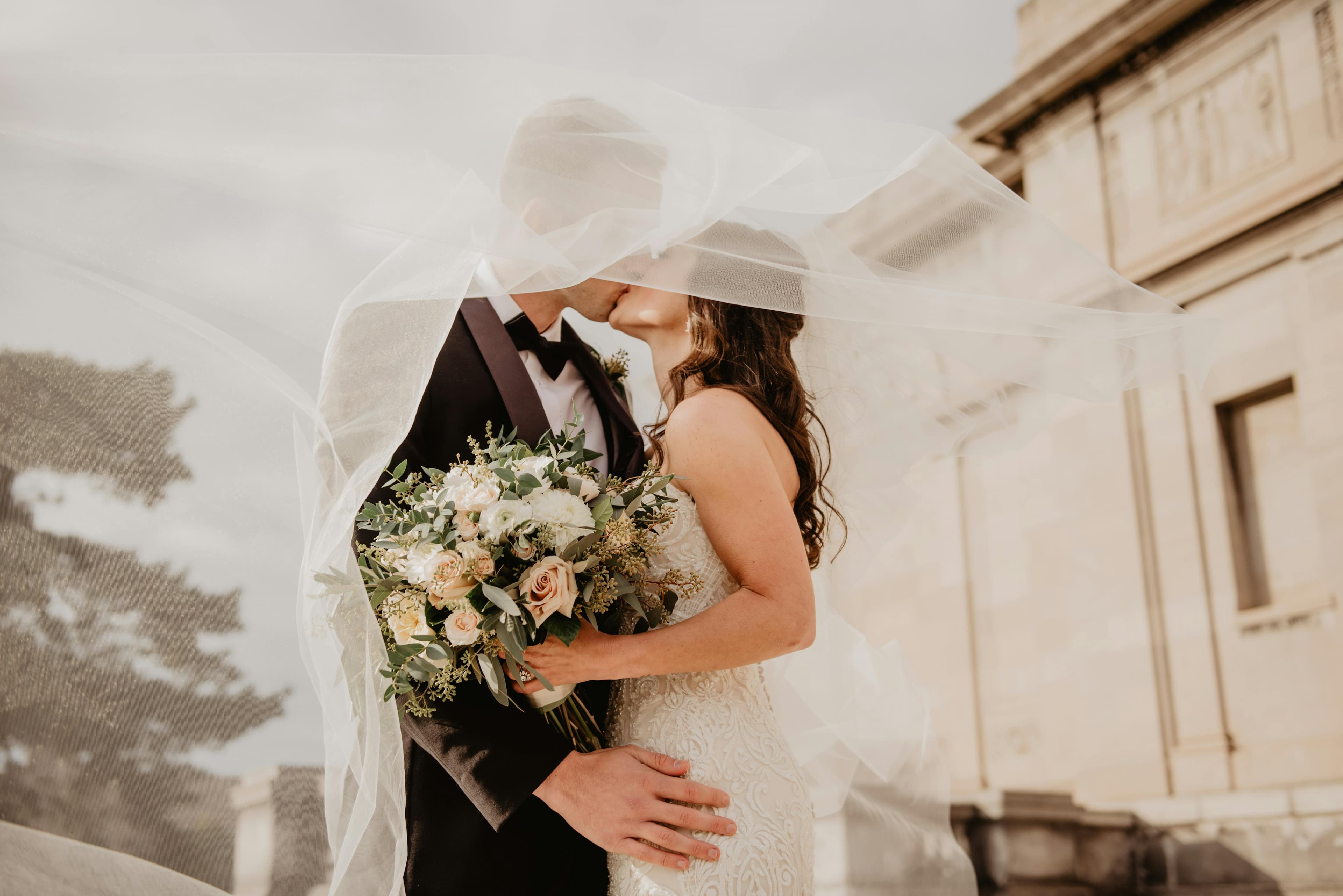 Bride and groom embracing during an elegant wedding celebration