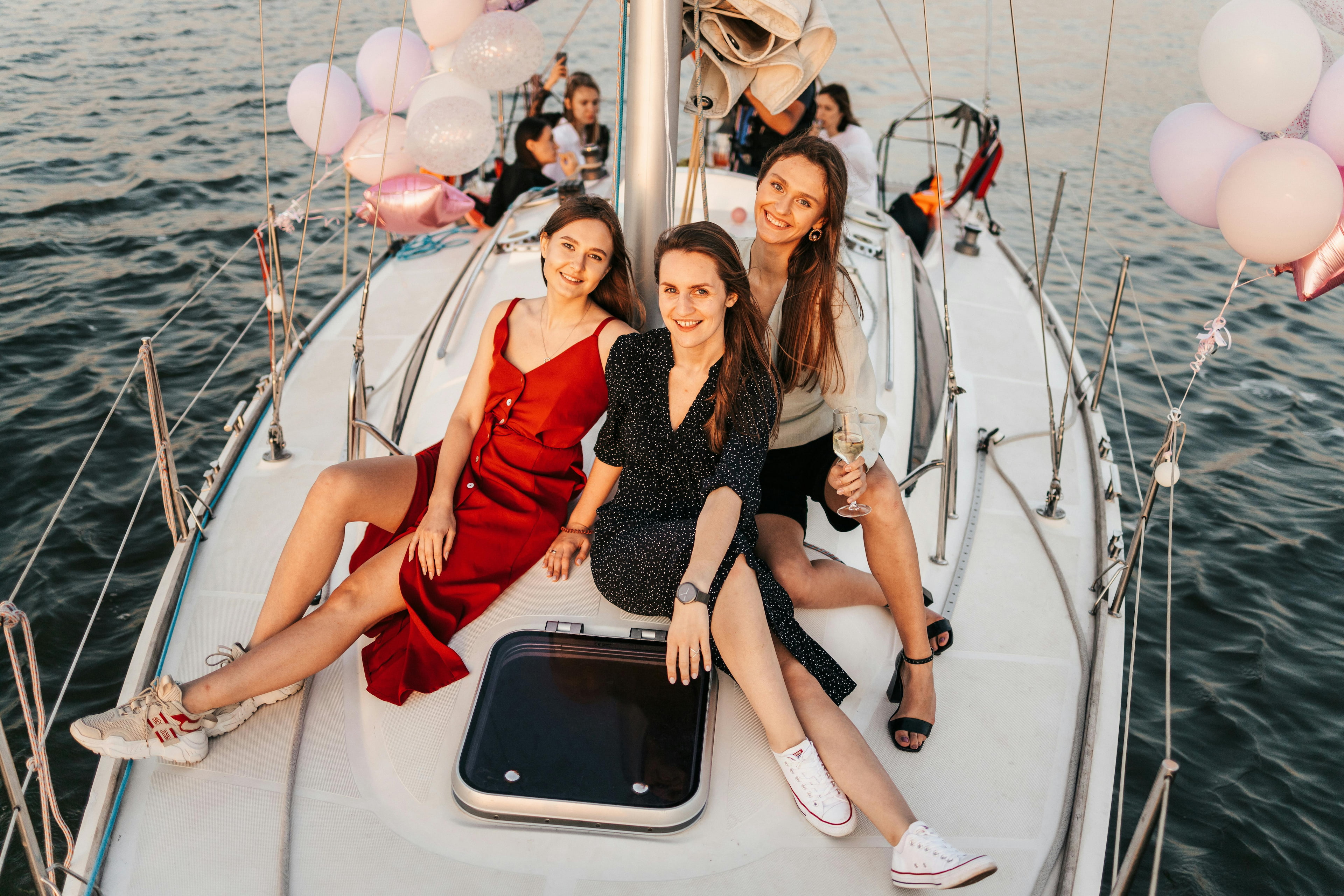 Guests enjoying a luxury yacht celebration at golden hour